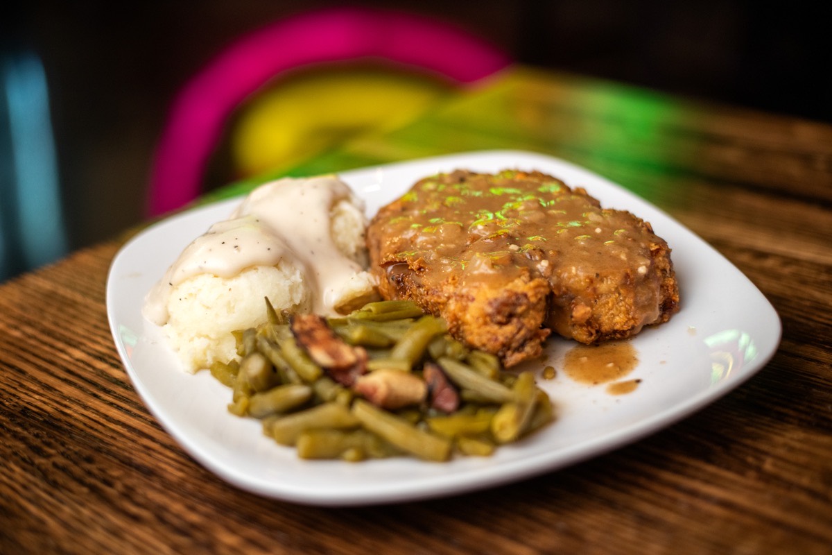 Smothered fried pork chop at Lefty’s Bar and Grill